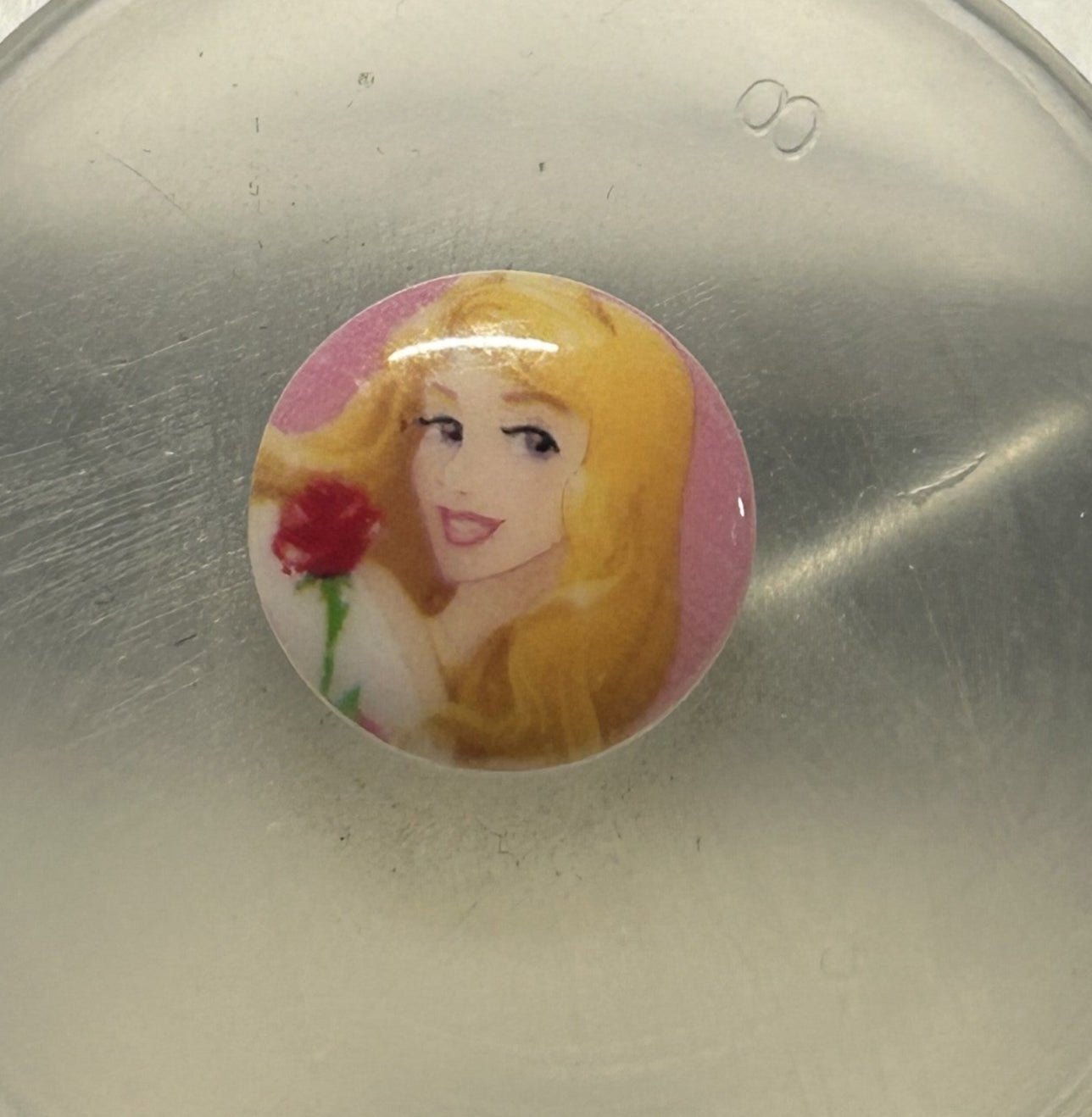 bottone bimbo/a RAPUNZEL 12 mm. (piccolo), originale DISNEY